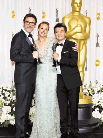 Režiser Michel Hazanavicius in njegova žena, igralka Berenice  Bejo, ter producent Thomas Langmann