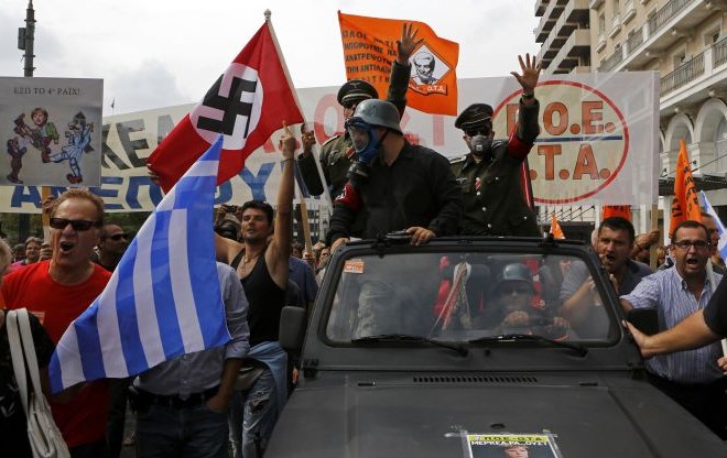 Merklova obljubila nadaljnjo pomoč Grčiji, Samaras spoštovanje zavez