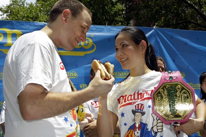 FILE - In this July 3, 2012, file photo, hot-dog eating champions Joey Chestnut, left, and Sonya "The Black Widow" Thomas...