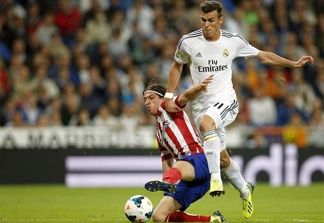 Filipe Luis in Gareth Bale sta bila v lanski sezoni velika tekmeca, odslej pa bosta soigralca. (Foto: Reuters) 