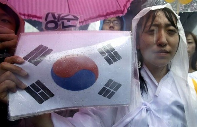Protesti v Korei, s katerimi zahtevajo, da Kitajska prevzame odgovornost za dogodke med vojno.