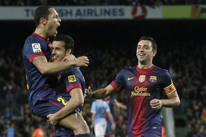 Xavi Hernandez, Adriano Correia in Pedro Rodriguez proslavljajo zadetek proti Celti Vigo. (Foto: Reuters)