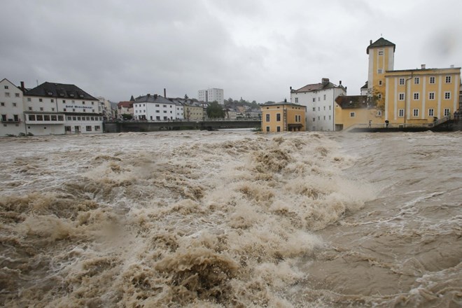 Flooded houses next to river Steyr are pictured during heavy rainfall in the small Austrian city of Steyr June 2, 2013....