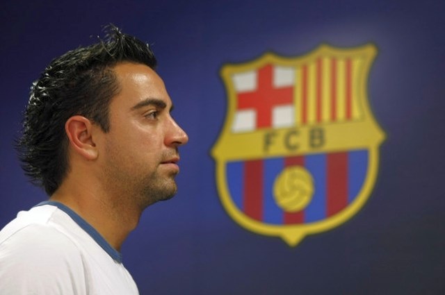 Xavi že vso kariero igra za Barcelono, kjer je tudi eden od kapetanov ekipe. (Foto: Reuters) 