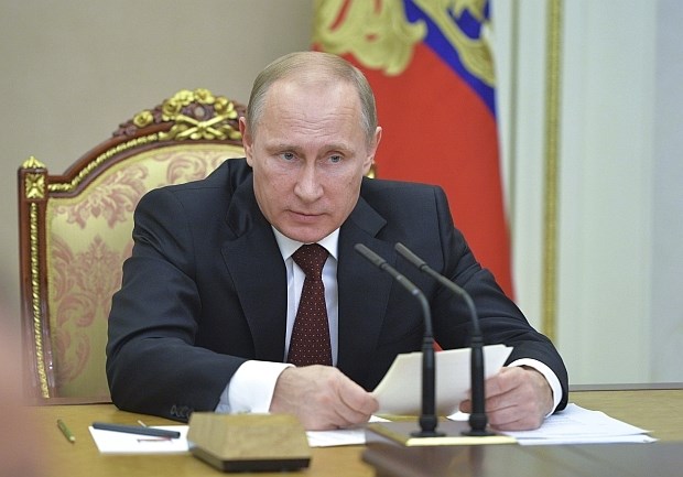 Pugačjova, ki je bil znan kot "bankir" ruskega predsednika Vladimirja Putina (na fotografiji), v Moskvi sedaj obtožujejo...