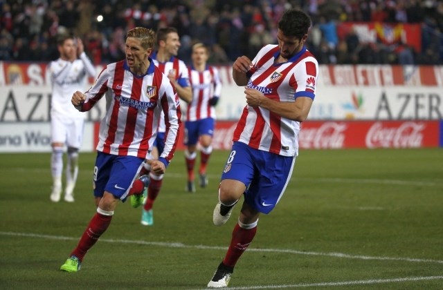Atletico, za katerega je debitiral Fernando Torres (levo) je z 2:0 premagal Real. (Foto: Reuters) 