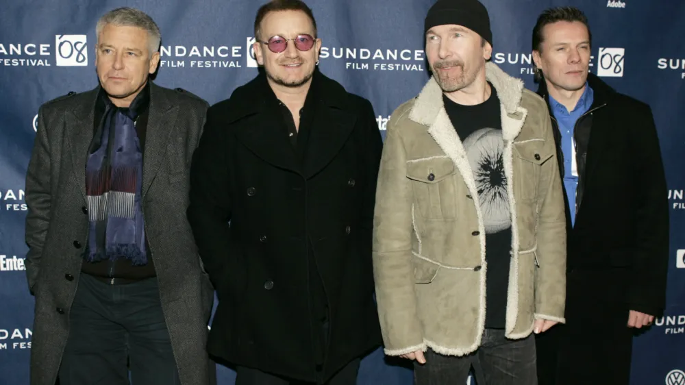 U2 band members, from left, Adam Clayton, Bono, The Edge, and Larry Mullen Jr. arrive at the premiere of their film 'U2 3D' at the Sundance Film Festival in Park City, Utah, on Saturday, Jan. 19, 2008. (AP Photo/Amy Sancetta)