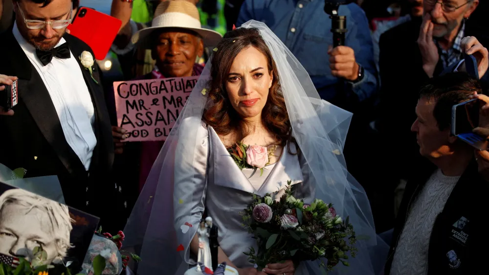 Stella Moris stands next to her wedding cake after departing HMP Belmarsh prison where she married WikiLeaks founder Julian Assange, in London, Britain March 23, 2022. REUTERS/Peter Nicholls   TPX IMAGES OF THE DAY