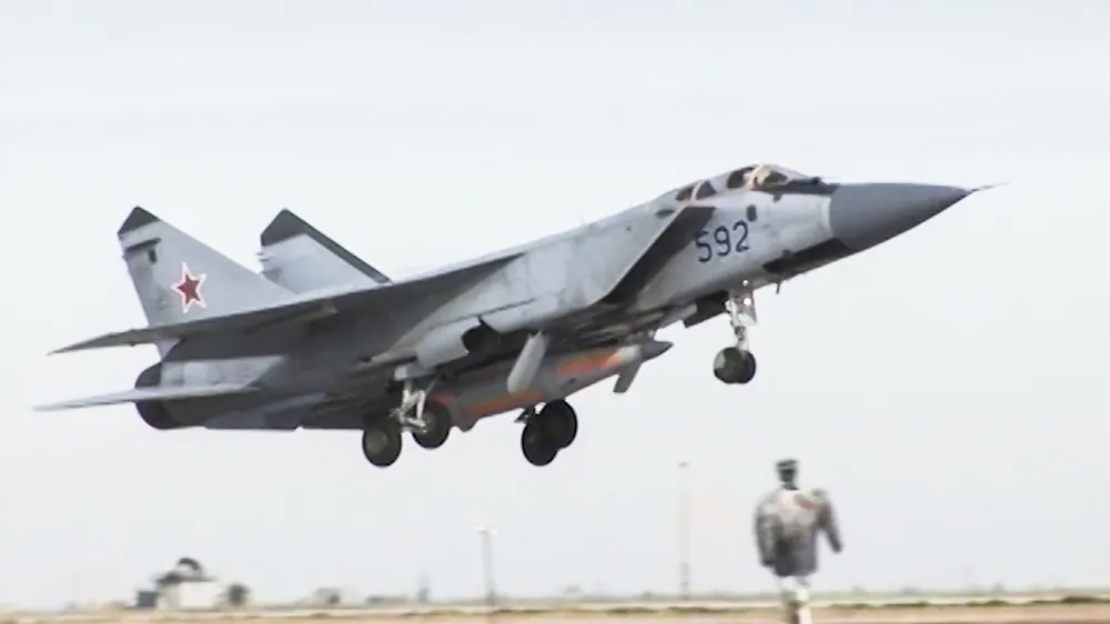 In this video grab provided by RU-RTR Russian television via AP television on Thursday, March 1, 2018, a Russian MiG-31 fighter jet carrying the new Kinzhal hypersonic missile flies at an undisclosed location in Russia. President Vladimir Putin declared Thursday that Russia has developed a range of new nuclear weapons, claiming they can't be intercepted by enemy. (RU-RTR Russian Television via AP)