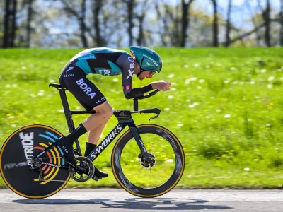 Aleksandr Vlasov from Russia competes in the prologue, a 5,12 km race against the clock at the 75th Tour de Romandie UCI ProTour cycling race in Lausanne, Switzerland, Tuesday, April 26, 2022. (Jean-Christophe Bott/Keystone via AP)