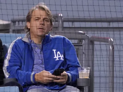 FILE - Los Angeles Dodgers co-owner Todd Boehly watches a baseball game against the Detroit Tigers Saturday, April 30, 2022, in Los Angeles. Chelsea is being sold to a consortium fronted by American sports investor Todd Boehly. It ends 19 years of ownership and lavish investment by Roman Abramovich until the Russian oligarch was sanctioned and forced to offload the Premier League club. The deal is worth 4.25 billion pounds (.24 billion). (AP Photo/Mark J. Terrill, File)