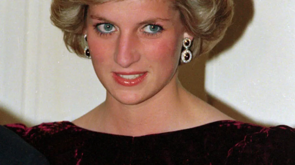 Britain's Princess Diana wears the Spencer tiara as she and Prince Charles attend state dinner at Government House in Adelaide, Austraila, Nov. 7, 1985. (AP Photo/Jim Bourdier)