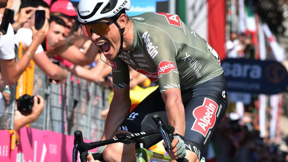 Cycling - Giro d'Italia - Stage 12 - Parma to Genoa, Italy - May 19, 2022 Alpecin-Fenix's Stefano Oldani celebrates after crossing the line to win Stage 12 REUTERS/Jennifer Lorenzini