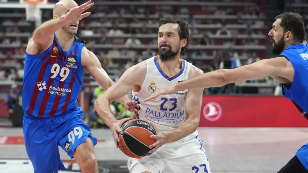 Real Madrid's Sergio Llull drives to the basket during a Final Four Euroleague semifinal basketball match between Barcelona and Real Madrid, in Belgrade, Serbia, Thursday, May 19, 2022. (AP Photo/Darko Vojinovic)