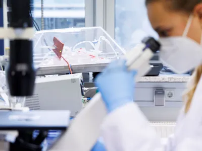 An employee of the vaccine company Bavarian Nordic works in a laboratory of the company in Martinsried near Munich, Germany, May 24, 2022. The company, headquartered in Denmark, is the only one in the world to have approval for a smallpox vaccine called Jynneos in the U.S. and Imvanex in Europe, which is also effective against monkeypox. REUTERS/Lukas Barth 