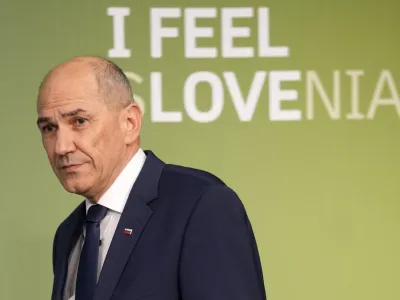 Outgoing Slovenian Prime Minister Janez Jansa walks on a stage to address the media in Ljubljana, Slovenia, Sunday, April 24, 2022. Early official results of Sunday's parliamentary election in Slovenia show that an opposition liberal party convincingly won, in a major defeat for populist Prime Minister Janez Jansa, who was accused of pushing the small European Union country to the right while in office. (AP Photo/Darko Bandic)