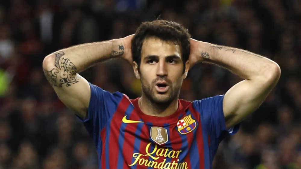 Barcelona's Francesc Fabregas reacts after missing a scoring opportunity during their Champions League semi-final second leg soccer match against Chelsea at Camp Nou stadium in Barcelona, April 24, 2012. REUTERS/Stefan Wermuth (SPAIN - Tags: SPORT SOCCER) 