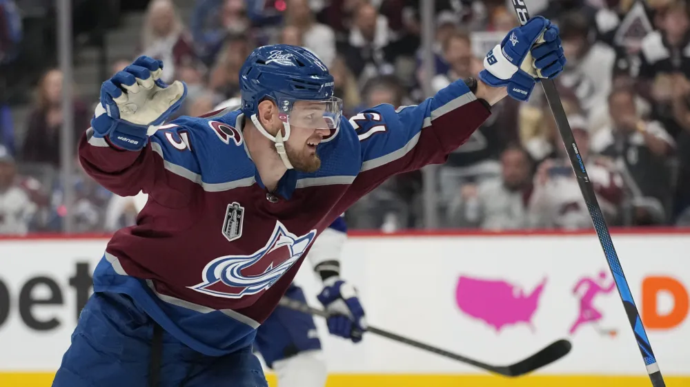 Colorado Avalanche right wing Valeri Nichushkin celebrates his goal against the Tampa Bay Lightning during the second period in Game 2 of the NHL hockey Stanley Cup Final, Saturday, June 18, 2022, in Denver. (AP Photo/John Locher)
