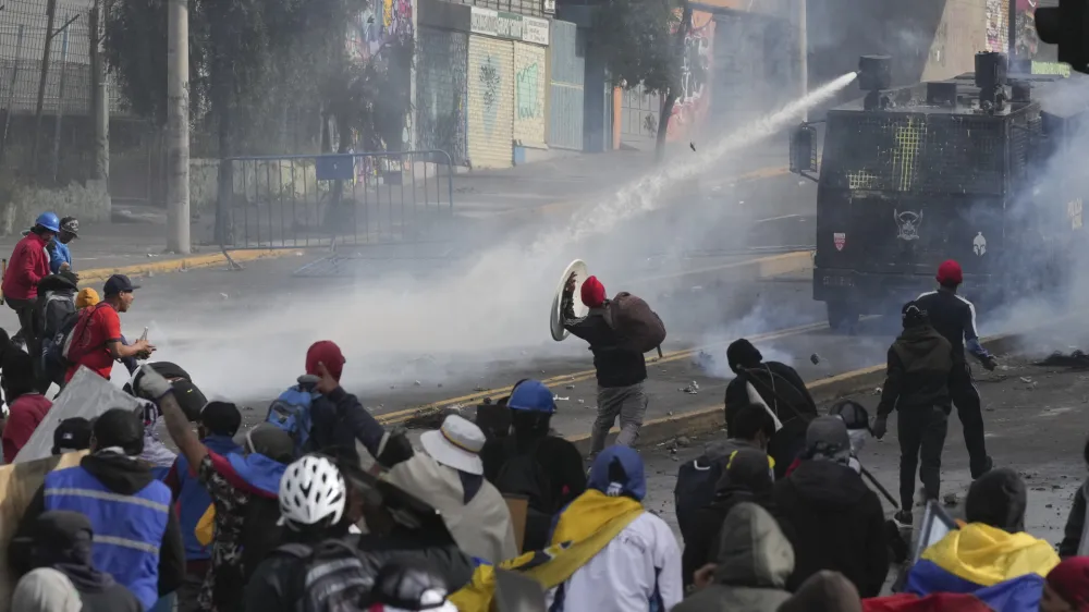 Demonstrators clash with police during protests against President Guillermo Lasso's economic policies and demanding a fuel price cut, in downtown Quito, Ecuador, Thursday, June 23, 2022. (AP Photo/Dolores Ochoa)