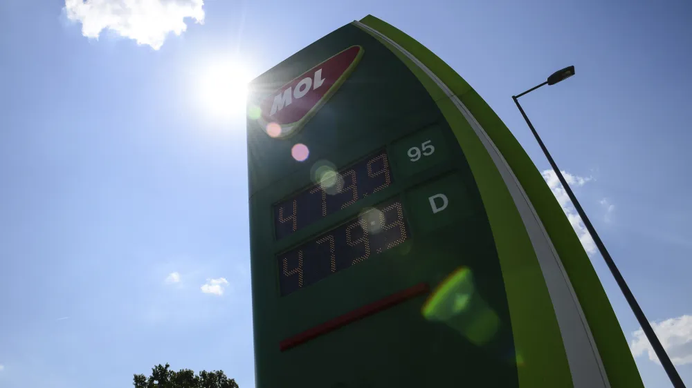 Discounted fuel prices are seen on a display of a petrol station, in Budapest, Hungary, Sunday, June 12, 2022. Hungary has placed price caps on fuel and some food and imposed special taxes on industries as the government tries to ease an economic downturn and the highest inflation in nearly 25 years. (AP Photo/Anna Szilagyi)