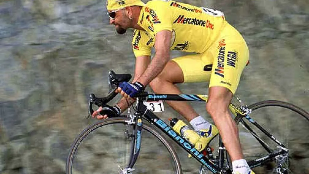 Marco Pantani speeds down a descent during stage one