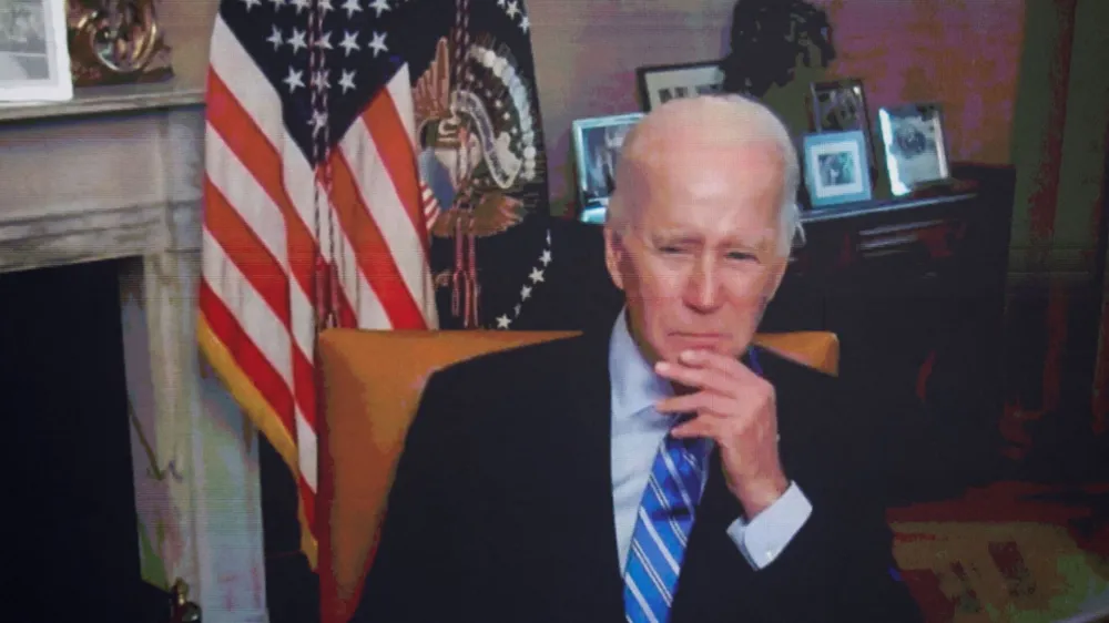 U.S. President Joe Biden, isolating following his COVID-19 diagnosis, appears virtually in a meeting with business and labor leaders about the Chips Act — relating to U.S. domestic chip and semiconductor manufacturing — in an auditorium on the White House campus in Washington, U.S., July 25, 2022. REUTERS/Jonathan Ernst