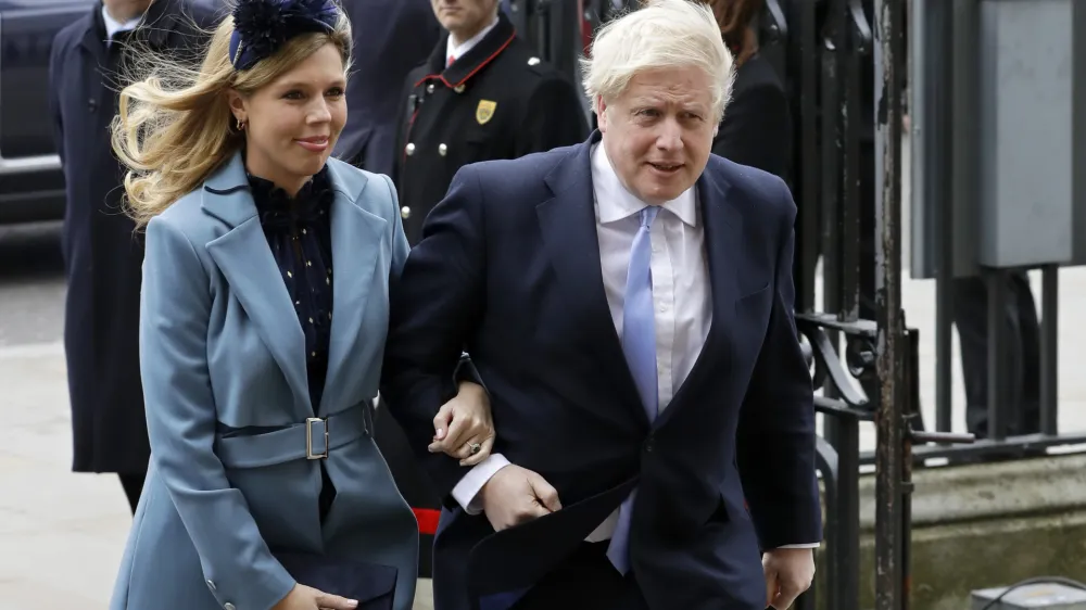FILE - In this Monday, March 9, 2020 file photo Britain's Prime Minister Boris Johnson and his partner Carrie Symonds arrive to attend the annual Commonwealth Day service at Westminster Abbey in London. Boris Johnson and his partner Carrie Symonds have announced she gave birth to a "healthy baby boy at a London hospital earlier this morning" Wednesday April 29, 2020, and both mother and baby are doing well. (AP Photo/Kirsty Wigglesworth, File)