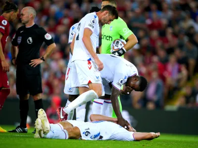 15 August 2022, United Kingdom, Liverpool: Crystal Palace's Joachim Andersen lies on the ground after being fouled by Liverpool's Darwin Nunez during the English Premier League soccer match between Liverpool and Crystal Palace at Anfield. Photo: Peter Byrne/PA Wire/dpa
