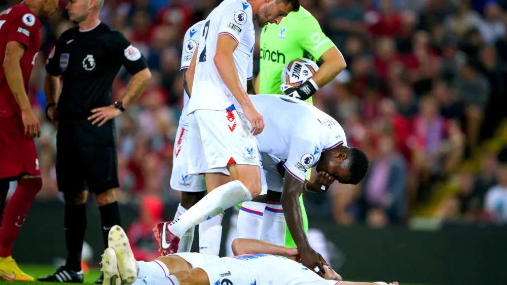15 August 2022, United Kingdom, Liverpool: Crystal Palace's Joachim Andersen lies on the ground after being fouled by Liverpool's Darwin Nunez during the English Premier League soccer match between Liverpool and Crystal Palace at Anfield. Photo: Peter Byrne/PA Wire/dpa