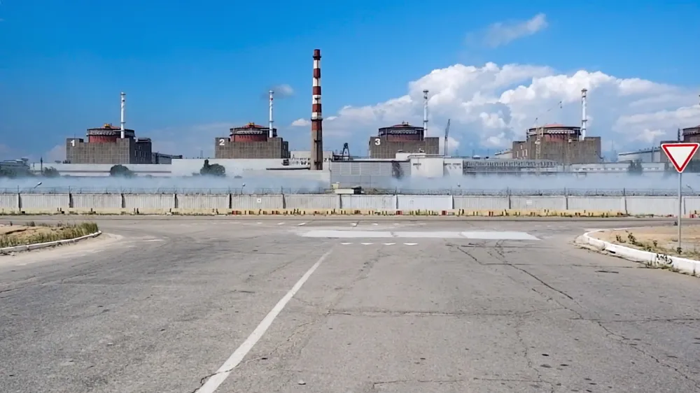 In this handout photo taken from video and released by Russian Defense Ministry Press Service on Sunday, Aug. 7, 2022, a general view of the Zaporizhzhia Nuclear Power Station in territory under Russian military control, southeastern Ukraine. The Russian military said that Ukrainian shelling of the Zaporizhzhia nuclear plant on Sunday caused a power surge and fire and forced staff to lower output from two reactors. (Russian Defense Ministry Press Service via AP)