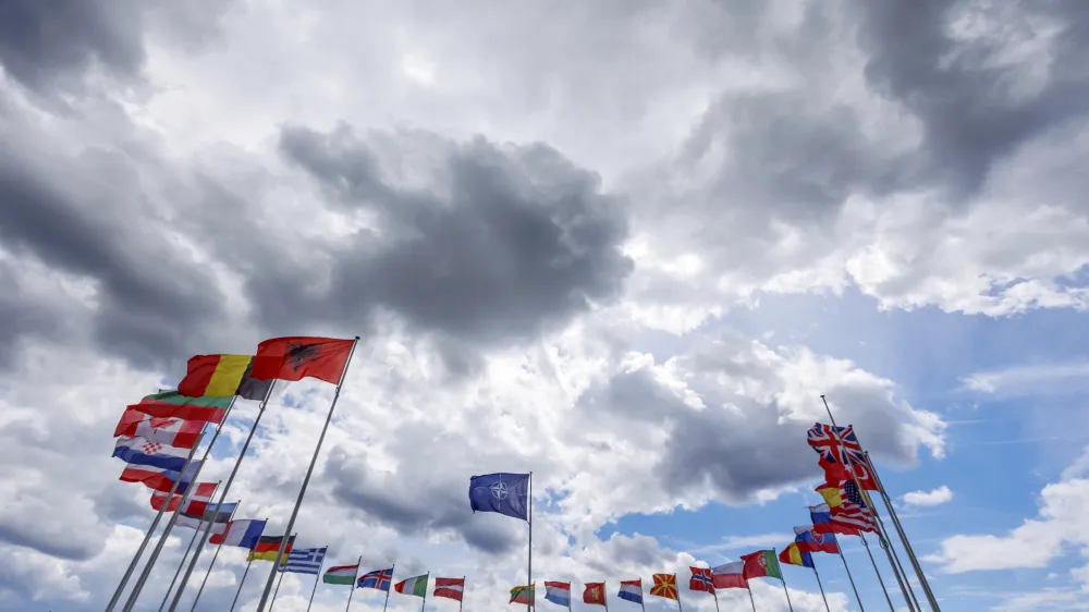 Flags of NATO member countries flap in the wind outside NATO headquarters prior to NATO Secretary General Jens Stoltenberg and the Chair of the Presidency of Bosnia and Herzegovina Sefik Dzaferovic speech at a media conference in Brussels, Wednesday, May 27, 2022. (AP Photo/Olivier Matthys)