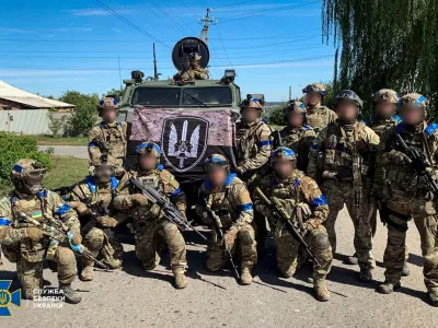 Service members of the State Security Service of Ukraine pose for a picture in the recently liberated town of Kupiansk, amid Russia's attack on Ukraine, in Kharkiv region, Ukraine in this handout picture released September 10, 2022. Press Service of the State Security Service of Ukraine/Handout via REUTERS ATTENTION EDITORS - THIS IMAGE HAS BEEN SUPPLIED BY A THIRD PARTY. DO NOT OBSCURE LOGO. THE IMAGE HAS BEEN BLURRED AT SOURCE.