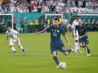 Argentina forward Lionel Messi kicks a goal, Friday, Sept. 23, 2022, during the first half of an international friendly soccer match against Honuras in Miami Gardens, Fla. (AP Photo/Wilfredo Lee)