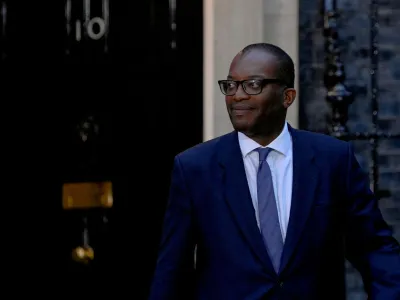 FILE PHOTO: New British Chancellor of the Exchequer Kwasi Kwarteng walks outside Number 10 Downing Street, in London, Britain September 6, 2022. REUTERS/Toby Melville/File Photo/File Photo
