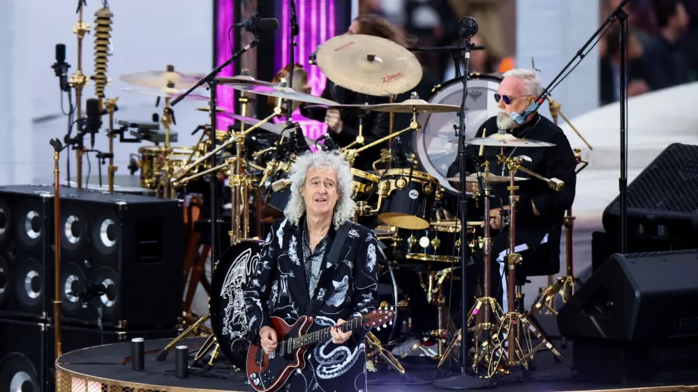 FILE PHOTO: Brian May plays the guitar as the band Queen performs at the Queen's Platinum Jubilee celebrations, in London, Britain June 4, 2022. REUTERS/Hannah McKay/Pool/File Photo