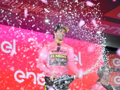 ﻿13 May 2019, Italy, Orbetello: Slovenian cyclist Primoz Roglic celebrates on stage after the end of the third stage of the 102nd edition of the Giro d'Italia cycling race, 220 km from Vinci to Orbetello. Photo: Massimo Paolone/Lapresse via ZUMA Press/dpa