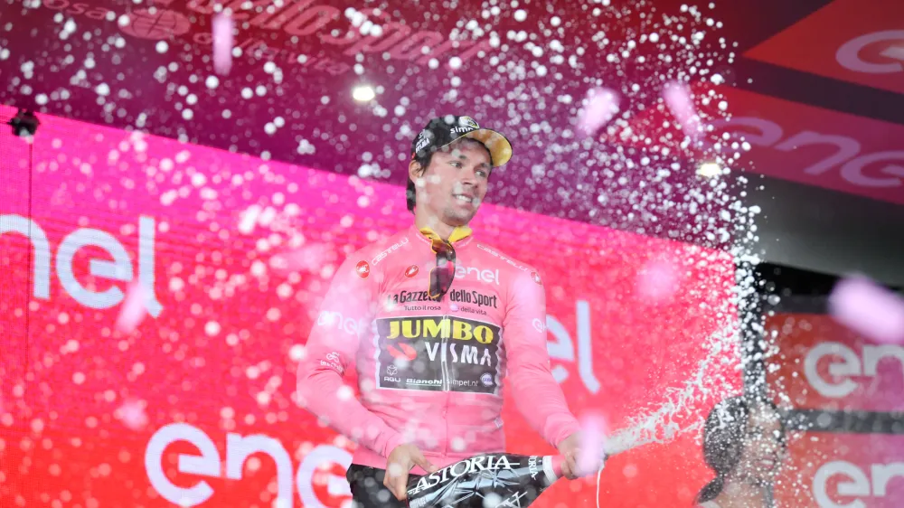 ﻿13 May 2019, Italy, Orbetello: Slovenian cyclist Primoz Roglic celebrates on stage after the end of the third stage of the 102nd edition of the Giro d'Italia cycling race, 220 km from Vinci to Orbetello. Photo: Massimo Paolone/Lapresse via ZUMA Press/dpa