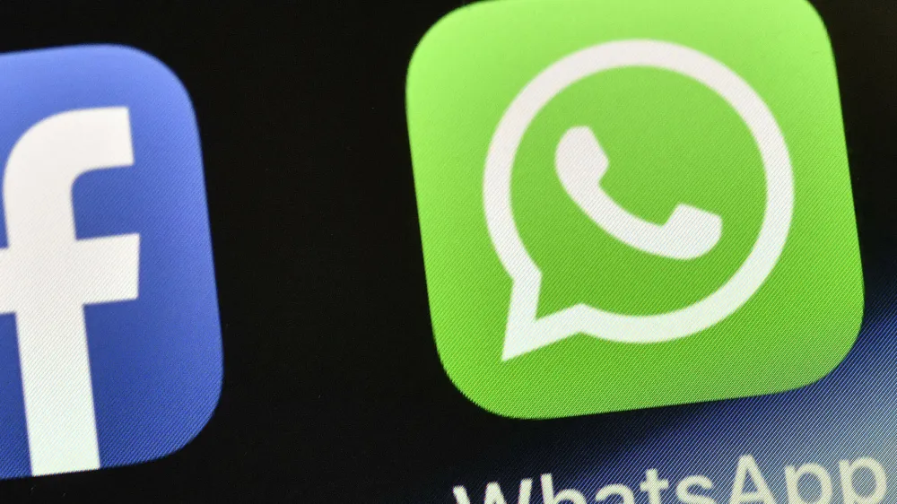FILE - The WhatsApp icon is seen on an iPhone in Gelsenkirchen, Germany, on Nov. 15, 2018. People around the world are reporting problems sending and receiving messages on the popular chat app WhatsApp. According to Downdetector, which tracks outage reports, people started reporting problems around 3 a.m. EDT. on Tuesday, Oct. 24, 2022. (AP Photo/Martin Meissner, File)