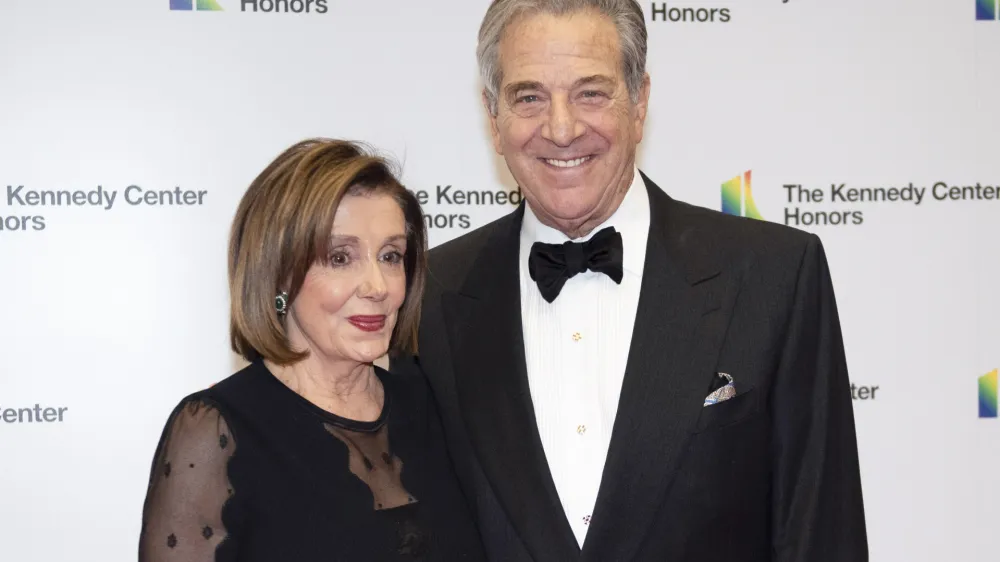 FILE - Speaker of the House Nancy Pelosi, D-Calif., and her husband, Paul Pelosi, arrive at the State Department for the Kennedy Center Honors State Department Dinner, on Dec. 7, 2019, in Washington. On Friday, Oct. 28, 2022, a man broke into House Speaker Nancy Pelosi's California home and severely beat her husband, Paul Pelosi, with a hammer. The 82-year-old underwent surgery to repair a skull fracture and serious injuries to his right arm and hands, and his doctors expect a full recovery, the speaker's office said Friday. There were no updates on his condition Saturday. (AP Photo/Kevin Wolf, File)