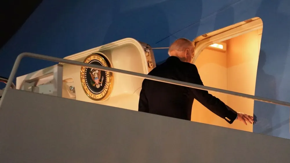 U.S. President Joe Biden boards Air Force One as he departs for Egypt to attend the COP27 summit from Joint Base Andrews in Maryland, U.S., November 10, 2022. REUTERS/Kevin Lamarque