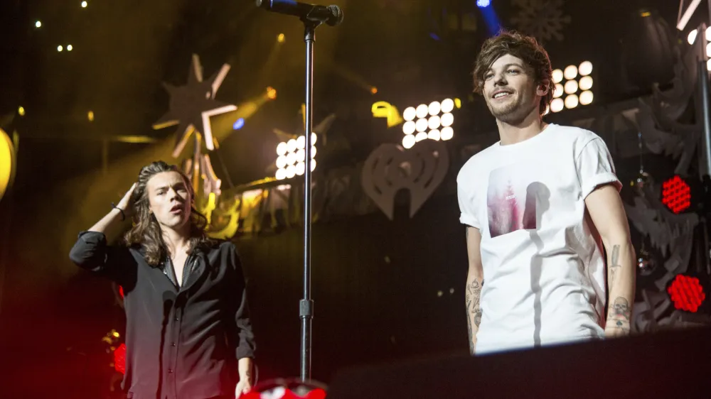 Harry Styles and Louis Tomlinson of One Direction perform during 106.1 KISS FM's iHeartRadio Jingle Ball at American Airlines Center on Dec. 1, 2015, in Dallas. (Photo by Amy Harris/Invision/AP)