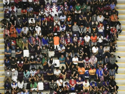 FILE - Soccer fans follow the game during the World Cup round of 16 soccer match between the Netherlands and the United States, at the Khalifa International Stadium in Doha, Qatar, Saturday, Dec. 3, 2022. (AP Photo/Hassan Ammar, File)
