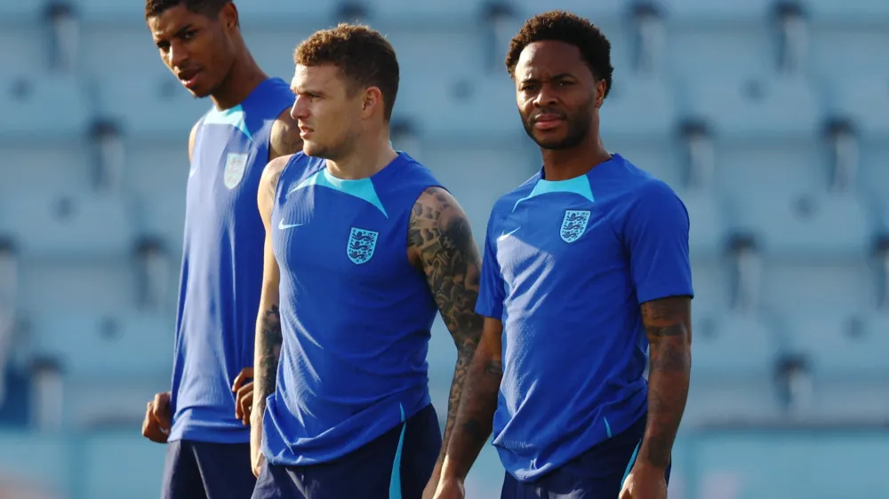 Soccer Football - FIFA World Cup Qatar 2022 - England Training - Al Wakrah SC stadium, Al Wakrah, Qatar - December 3, 2022 England's Marcus Rashford, Kieran Trippier and Raheem Sterling during training REUTERS/Hannah Mckay