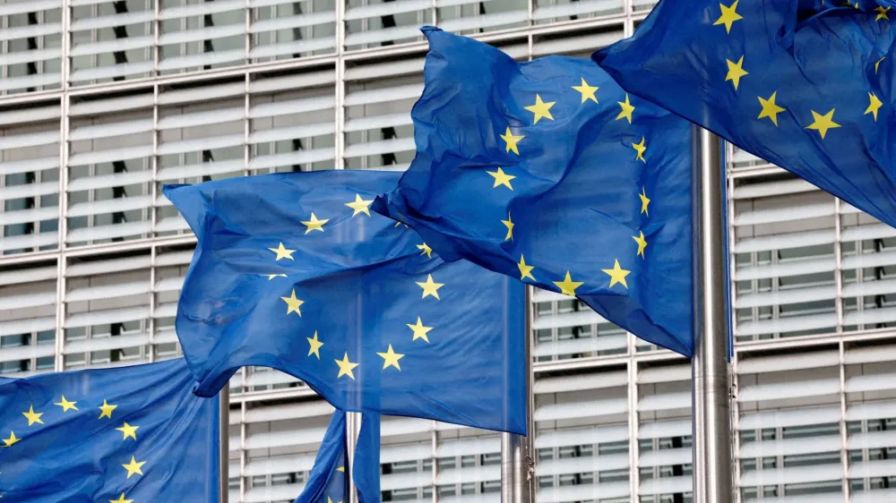 FILE PHOTO: European Union flags flutter outside the EU Commission headquarters in Brussels, Belgium, September 28, 2022. REUTERS/Yves Herman//File Photo/File Photo