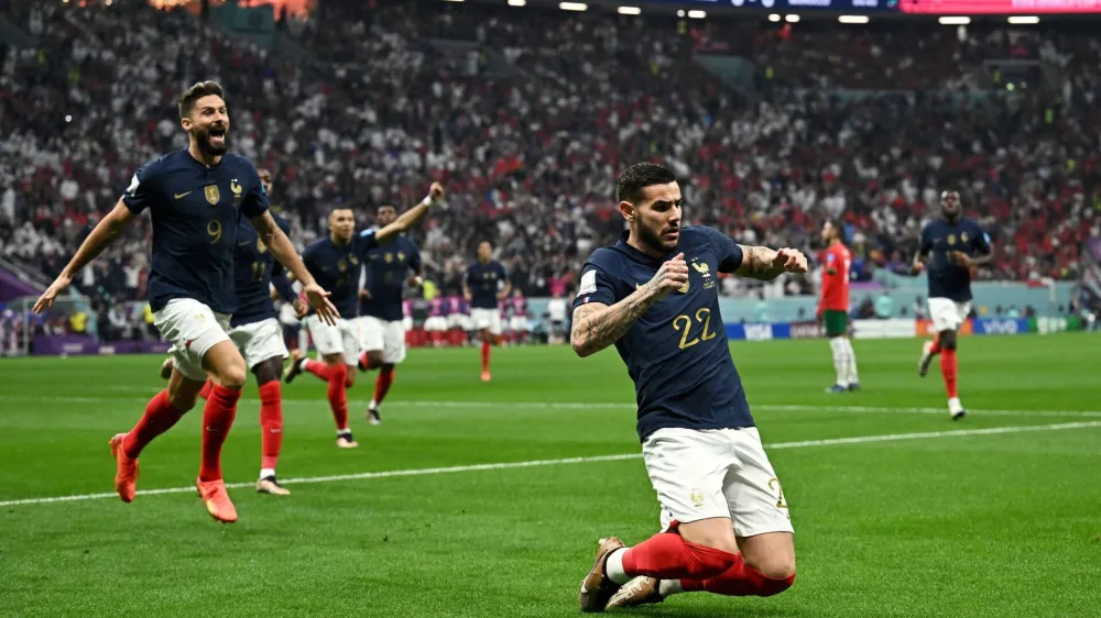 Soccer Football - FIFA World Cup Qatar 2022 - Semi Final - France v Morocco - Al Bayt Stadium, Al Khor, Qatar - December 14, 2022 France's Theo Hernandez celebrates scoring their first goal with Olivier Giroud REUTERS/Dylan Martinez   TPX IMAGES OF THE DAY