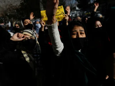 Afghan women chant slogans in protest against the closure of universities to women by the Taliban in Kabul, Afghanistan, December 22, 2022. REUTERS/Stringer