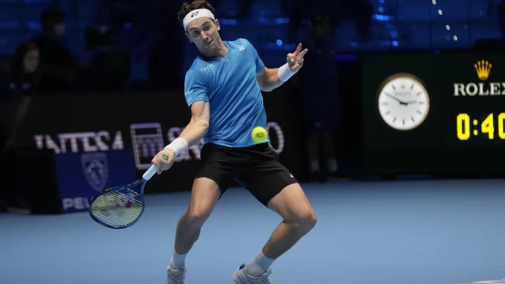 ﻿Norways' Casper Ruud returns the ball to Russia's Andrey Rublev during their ATP World Tour Finals singles tennis match, at the Pala Alpitour in Turin, Friday, Nov. 19, 2021. (AP Photo/Luca Bruno)
