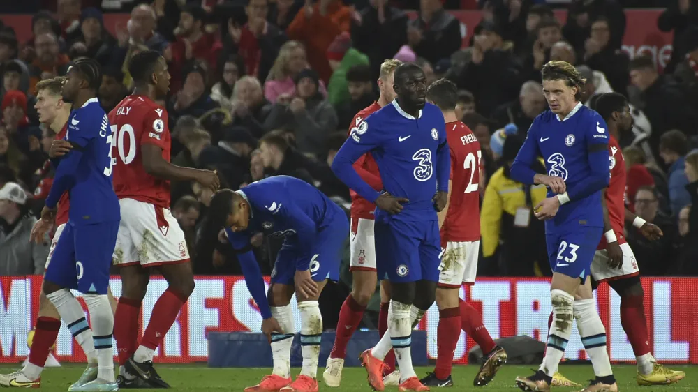 Chelsea players react after final whistle of the English Premier League soccer match between Nottingham Forest and Chelsea at City ground in Nottingham, England, Sunday, Jan. 1, 2023. (AP Photo/Rui Vieira)