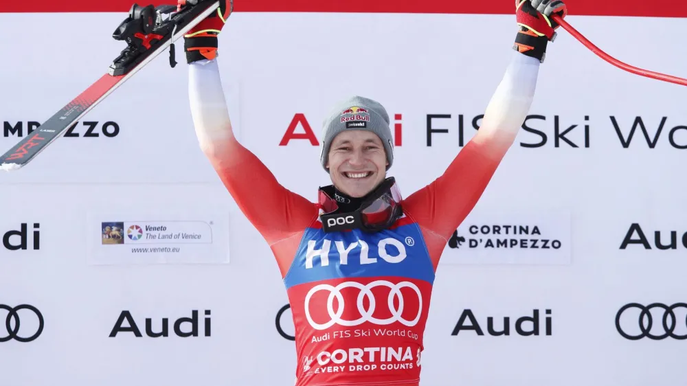 Alpine Skiing - FIS Alpine Ski World Cup - Men's Super G - Cortina d'Ampezzo, Italy - January 28, 2023 Switzerland's Marco Odermatt celebrates on the podium after placing first REUTERS/Alessandro Garofalo