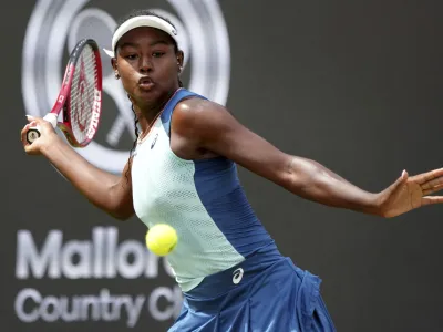 FILE - Alycia Parks from the United States returns the ball to Ons Jabeur from Tunisia during their WTA tournament round of 16 tennis match in Berlin, Germany, June 16, 2022. On Sunday, Feb. 5, 2023, Parks secured a stunning 7-6 (7), 7-5 upset win over WTA Finals champion Caroline Garcia in the Open M&eacute;tropole de Lyon final to clinch her first career title. (AP Photo/Michael Sohn, File)
